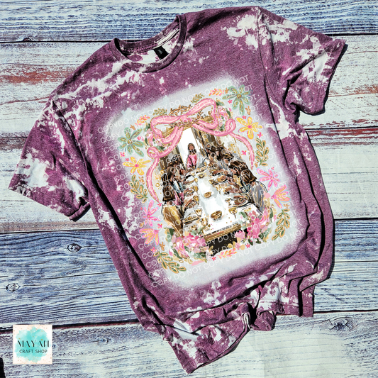 Bleached t-shirt with a decorative graphic on a wooden surface