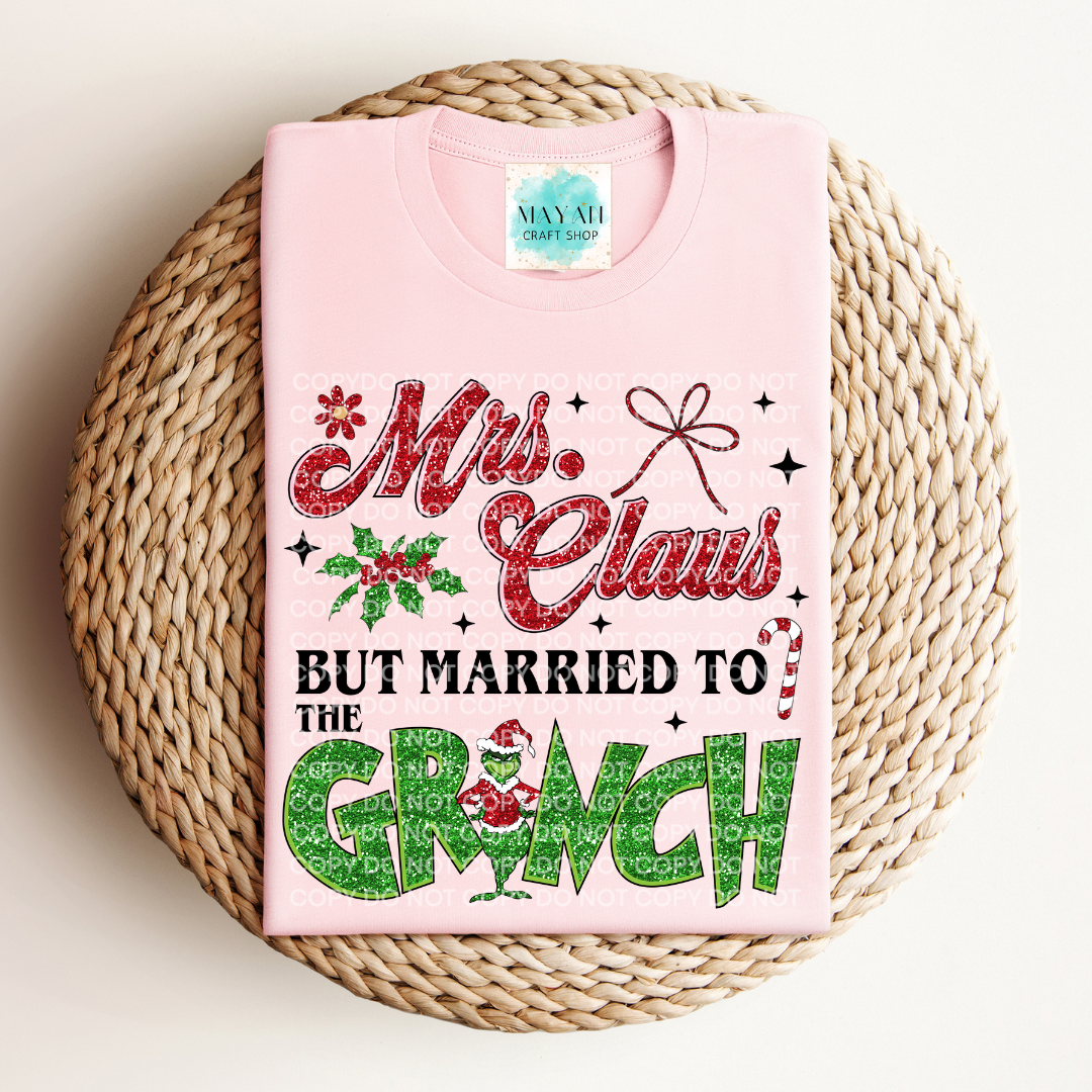 Mrs. Claus married to grinch heather pink shirt. -Mayan Craft Shop