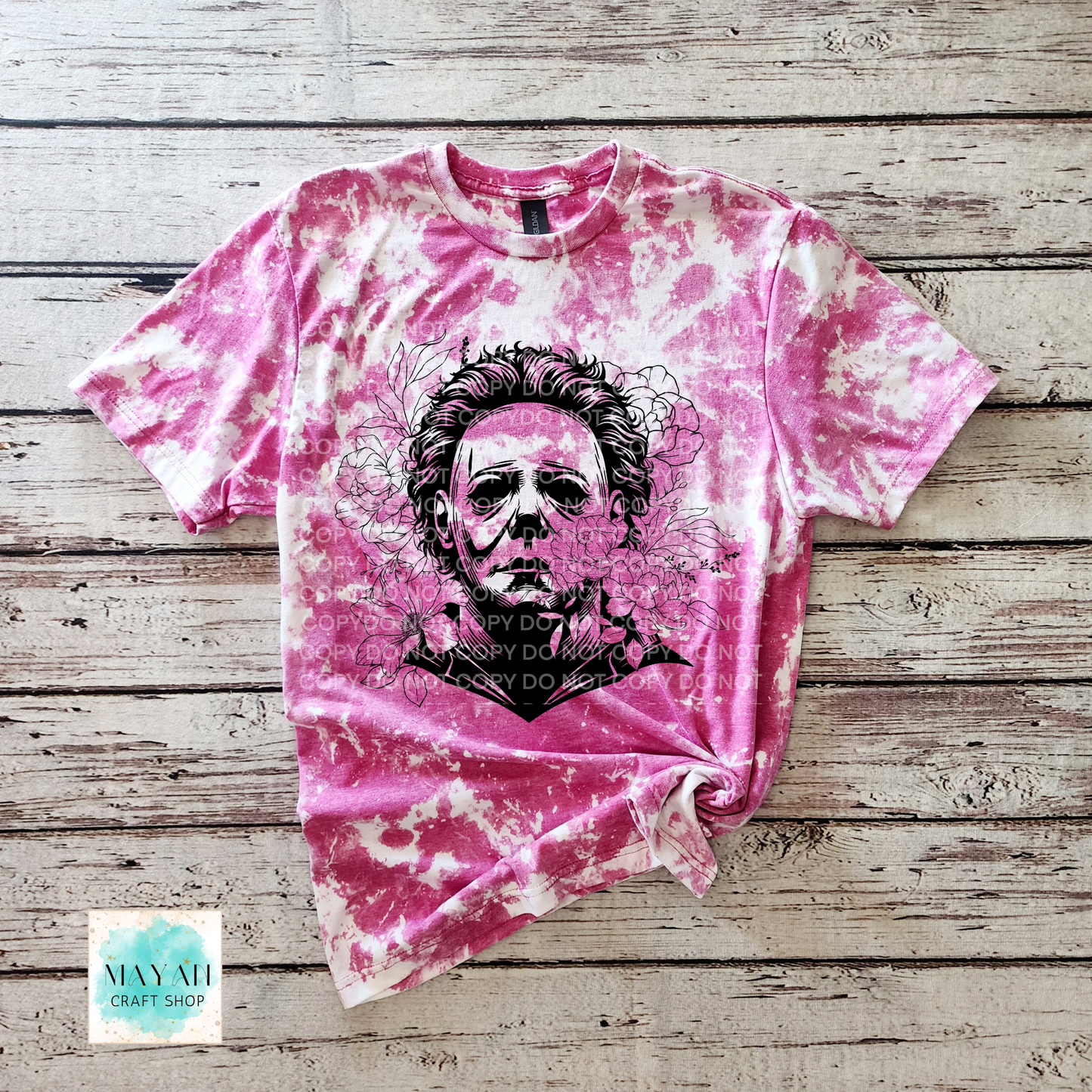 Heliconia bleached t-shirt with a graphic design on a wooden surface