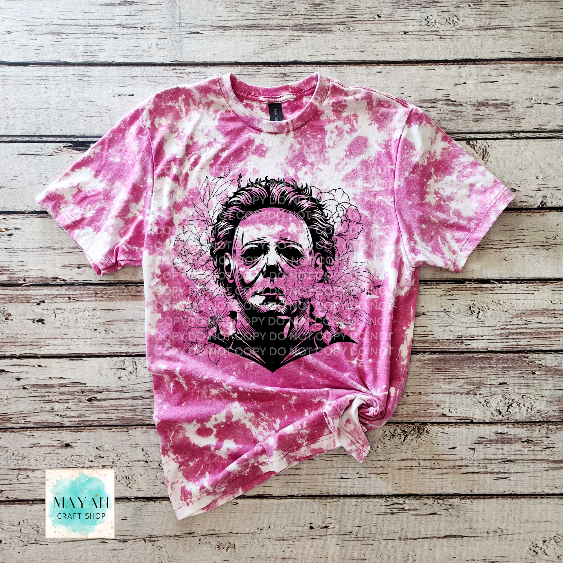 Heliconia bleached t-shirt with a graphic design on a wooden surface
