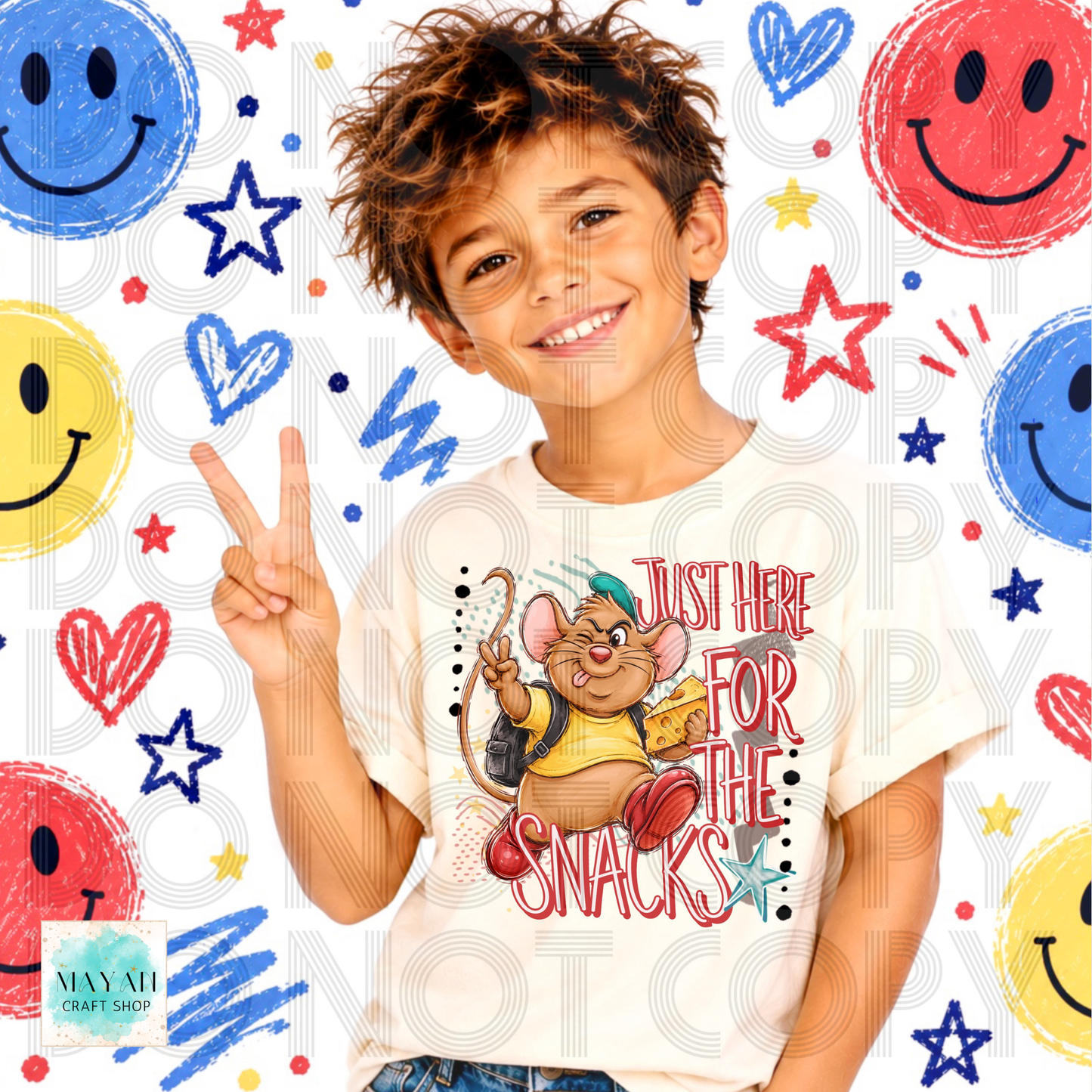 A smiling young boy wearing a white graphic t-shirt with a cartoon mouse holding a bag of chips and the text 'JUST HERE FOR THE SNACKS'. The boy is posing with his fingers out against a white background decorated with colorful faces, stars, and hearts.
