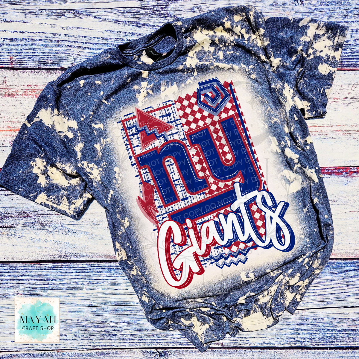A short-sleeve bleached heather navy, featuring a large football team graphic on the front. The graphic includes red, white, and blue colors with a patterned design.