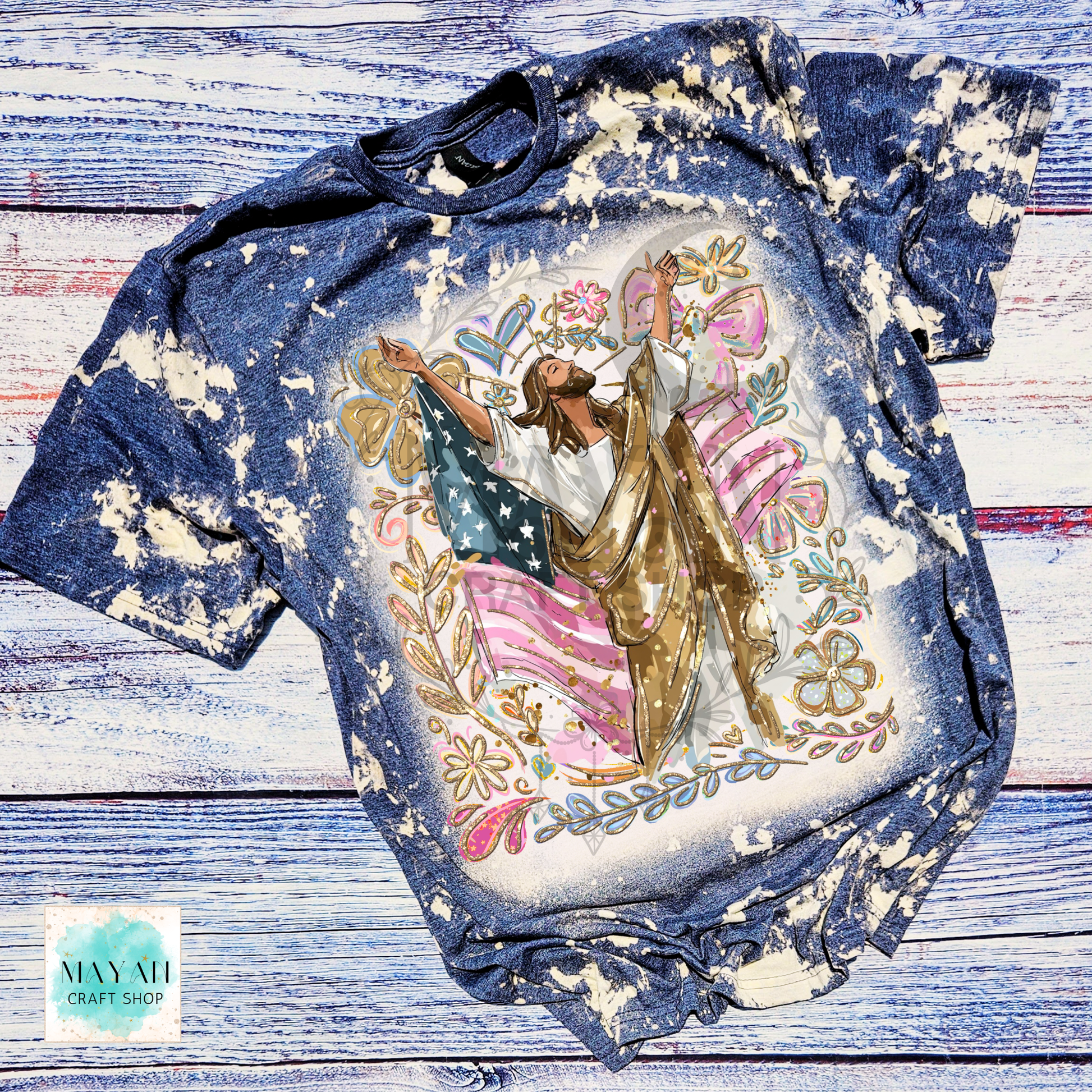 Bleached t-shirt with a graphic design of a person holding an American flag on a wooden surface.
