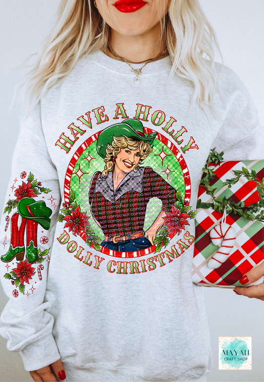 White sweatshirt with Christmas-themed design featuring a graphic of a woman and text 'Have a Holly Dolly Christmas'.