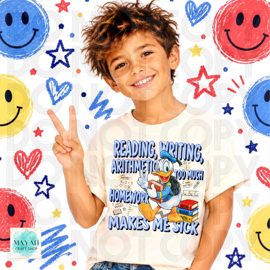 A smiling young boy wearing a white graphic t-shirt with a cartoon design and text that reads 'READING, WRITING, ARITHMETIC TOO MUCH HOMEMWORK MAKES ME SICK'. The background is white with colorful faces, stars, and hearts.