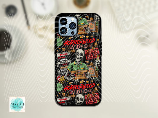 Phone case with Halloween-themed design featuring a skeleton and text on a black background.