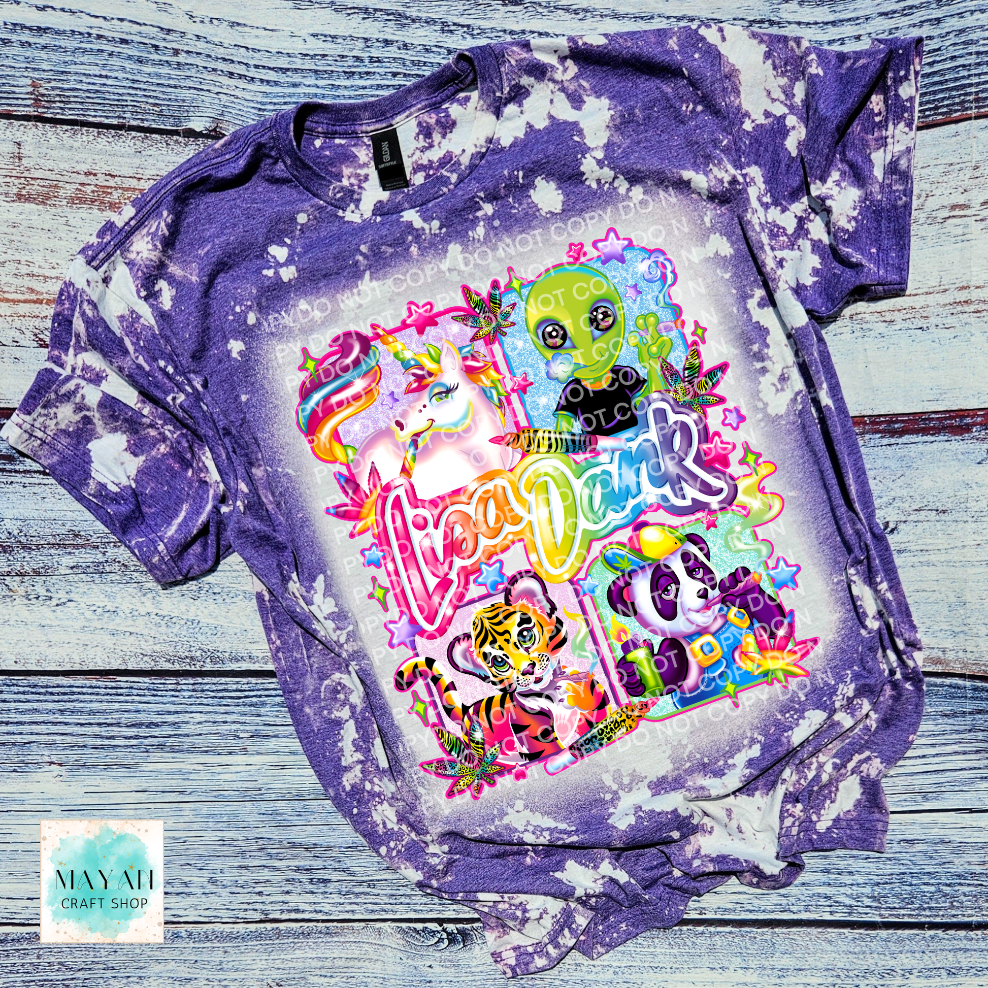 Dyed t-shirt with colorful graphic design on a wooden surface