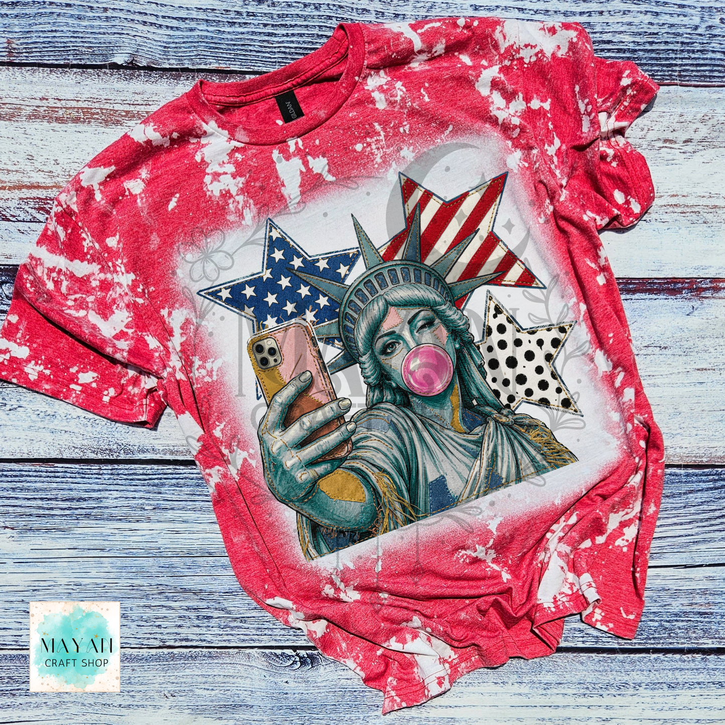 Red and white tie-dye shirt with a graphic of the Statue of Liberty taking a selfie.