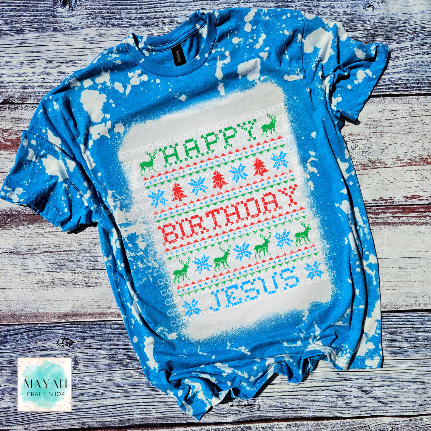 Blue and white bleached t-shirt with 'Happy Birthday Jesus' text on a wooden surface