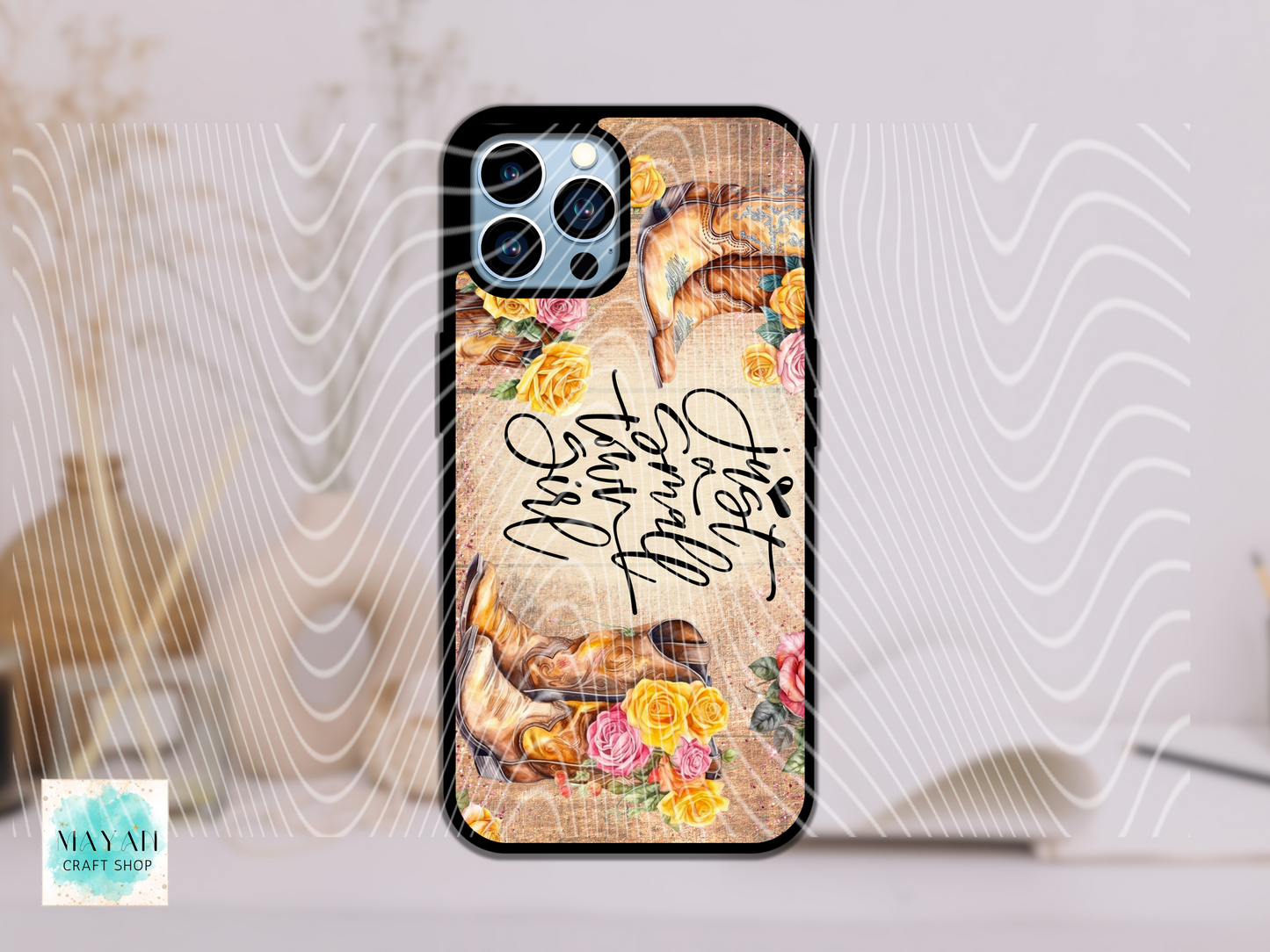 Phone case with floral design and text on a light background