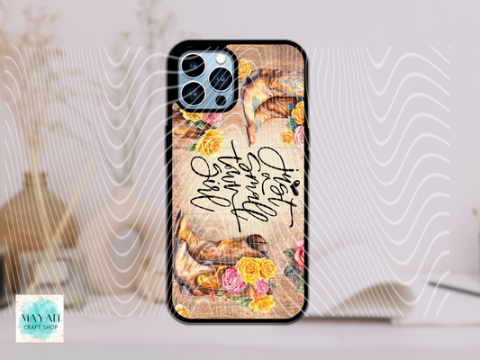Phone case with floral design and text on a light background