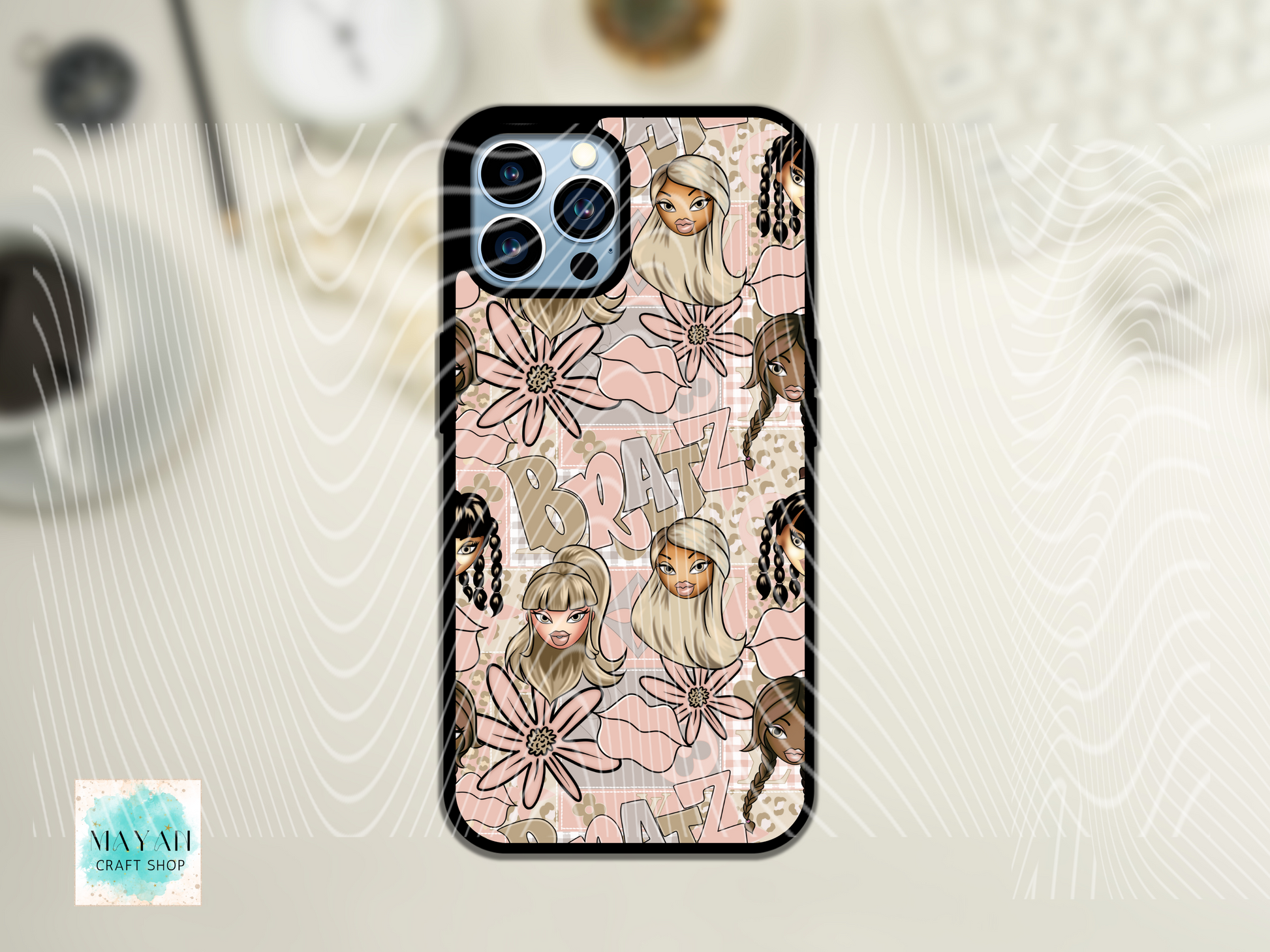Phone case with illustrated design of a girl, flowers, and letters on a light background