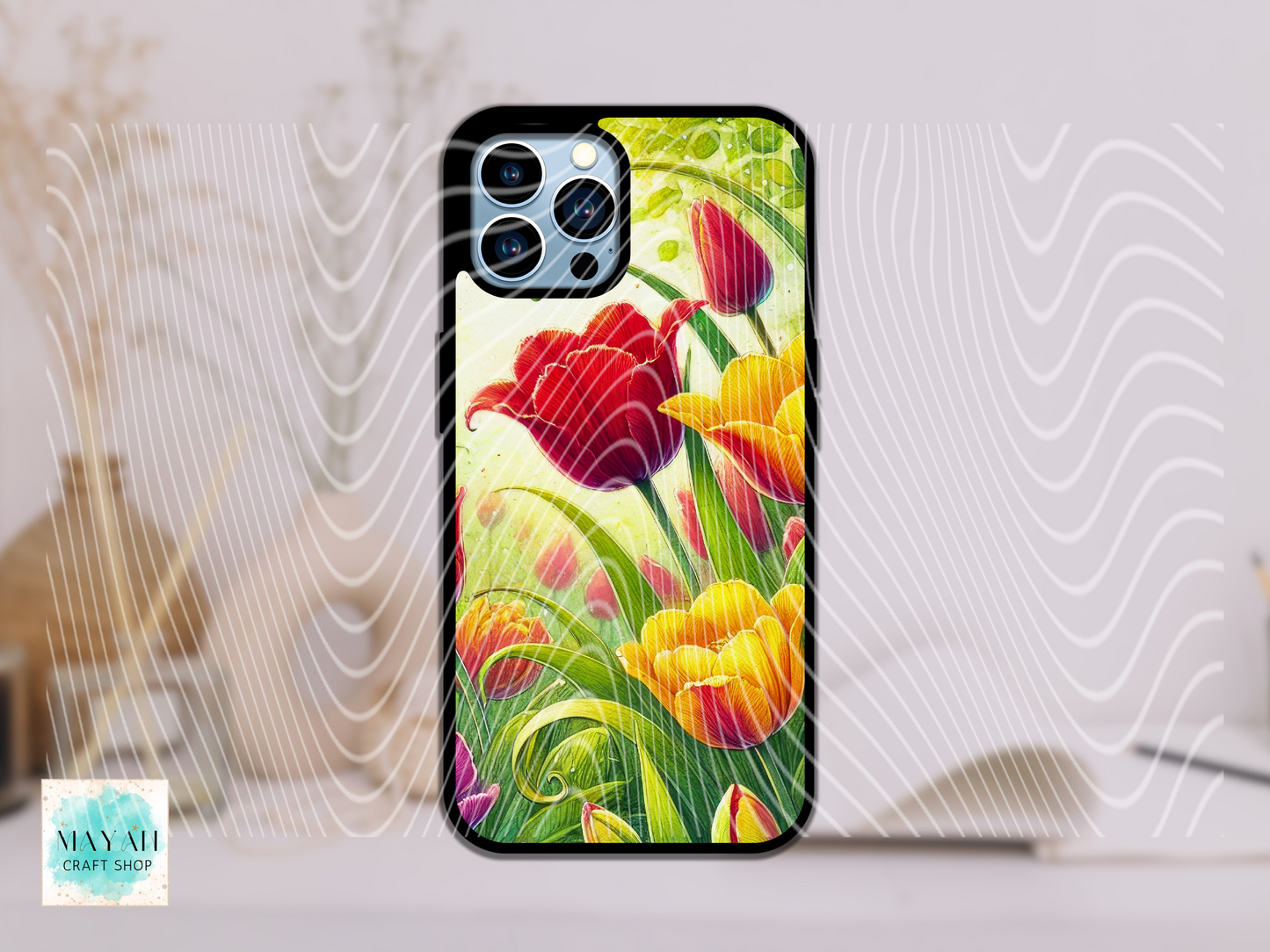 Phone case with colorful tulip design on a light background