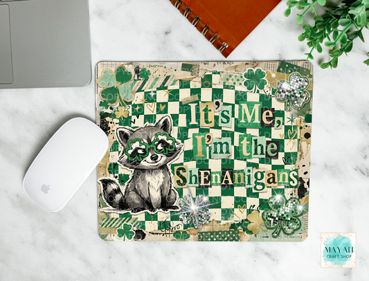 Mouse pad with raccoon illustration and text on a marble surface