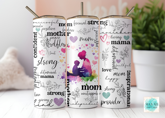 Three tumblers with mother-themed designs on a light surface with a plant in the background.