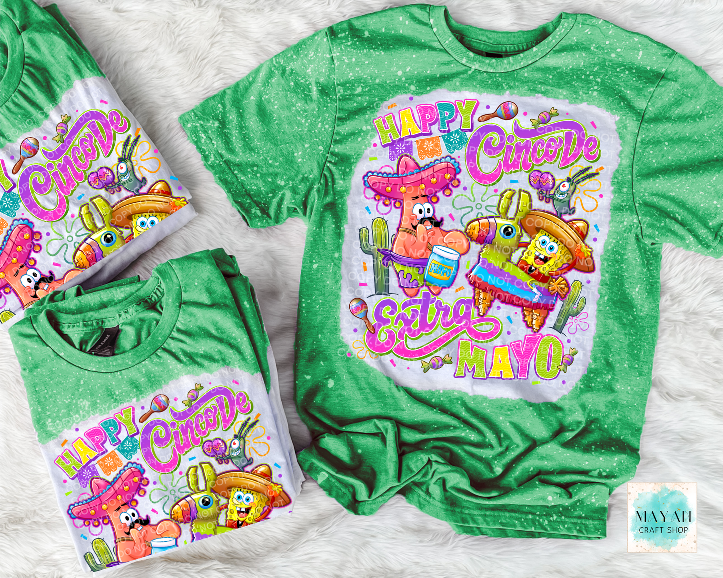 Green t-shirt with colorful 'Happy Cinco de Mayo' design on a white textured background