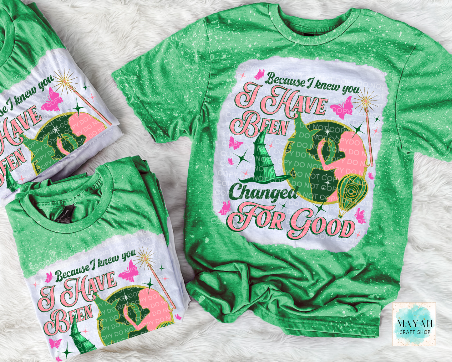 Green t-shirt with graphic design and text on a white background