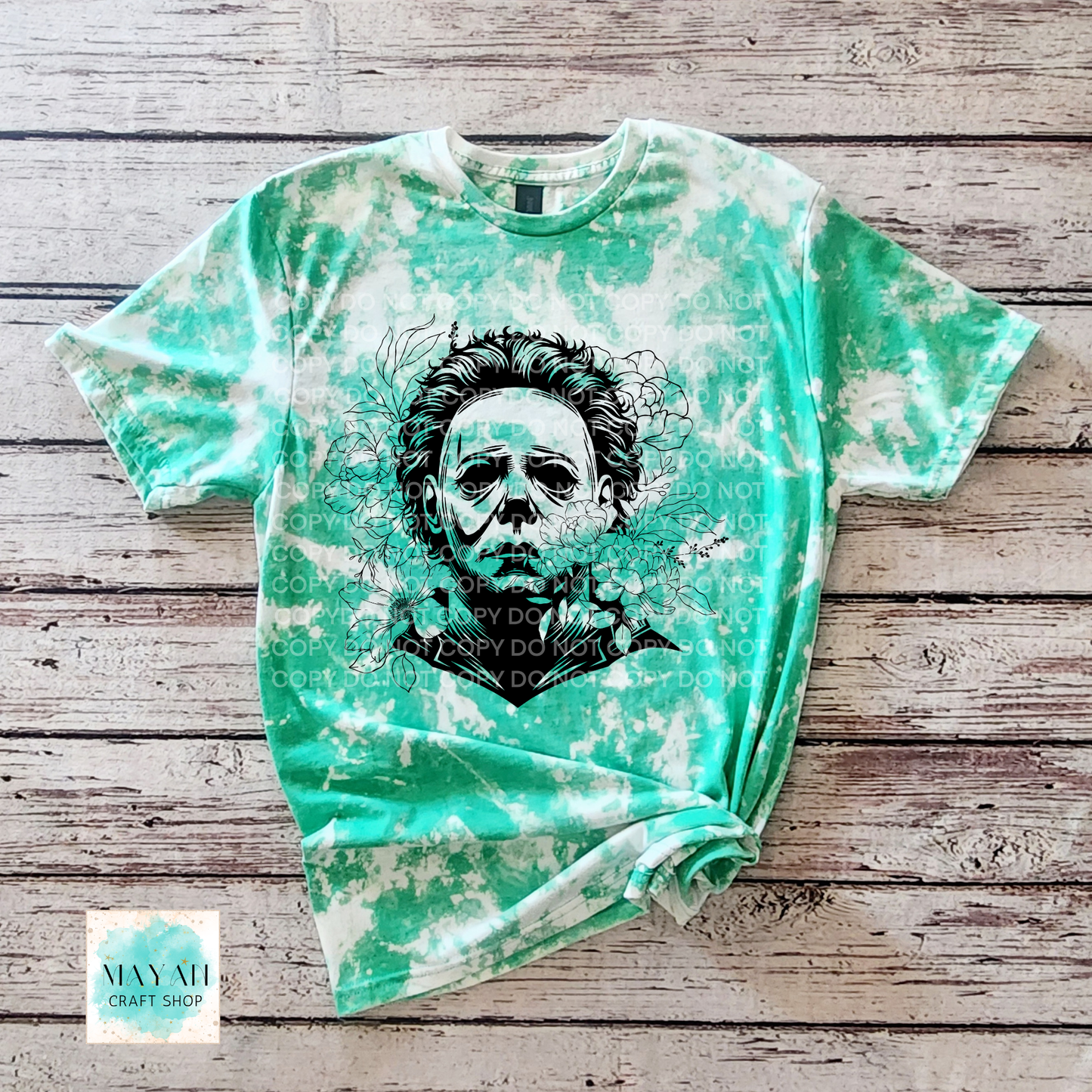 Bleached t-shirt with a graphic design on a wooden surface
