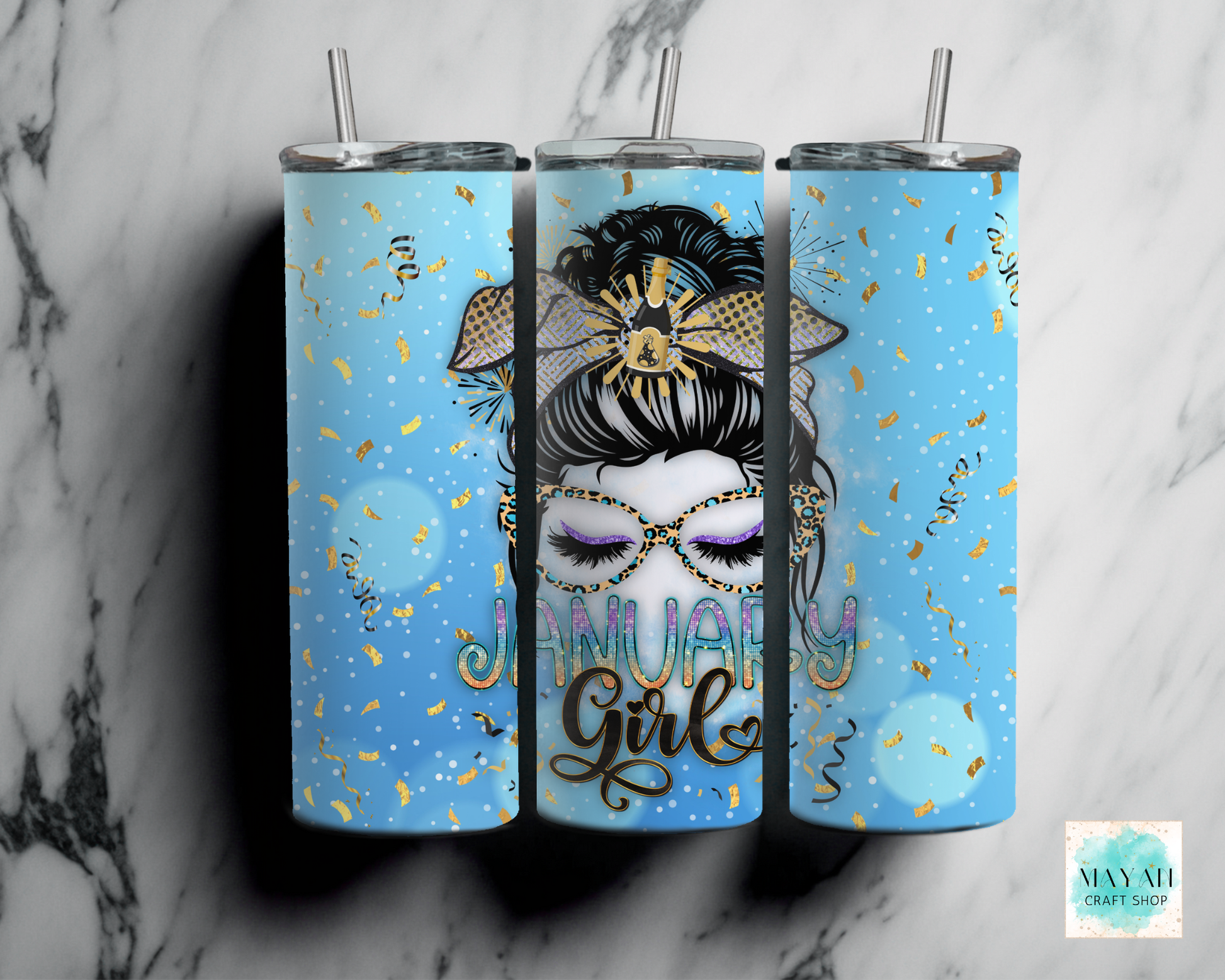 Three tumblers with a design of a woman's face, text, and decorative elements on a marble background.