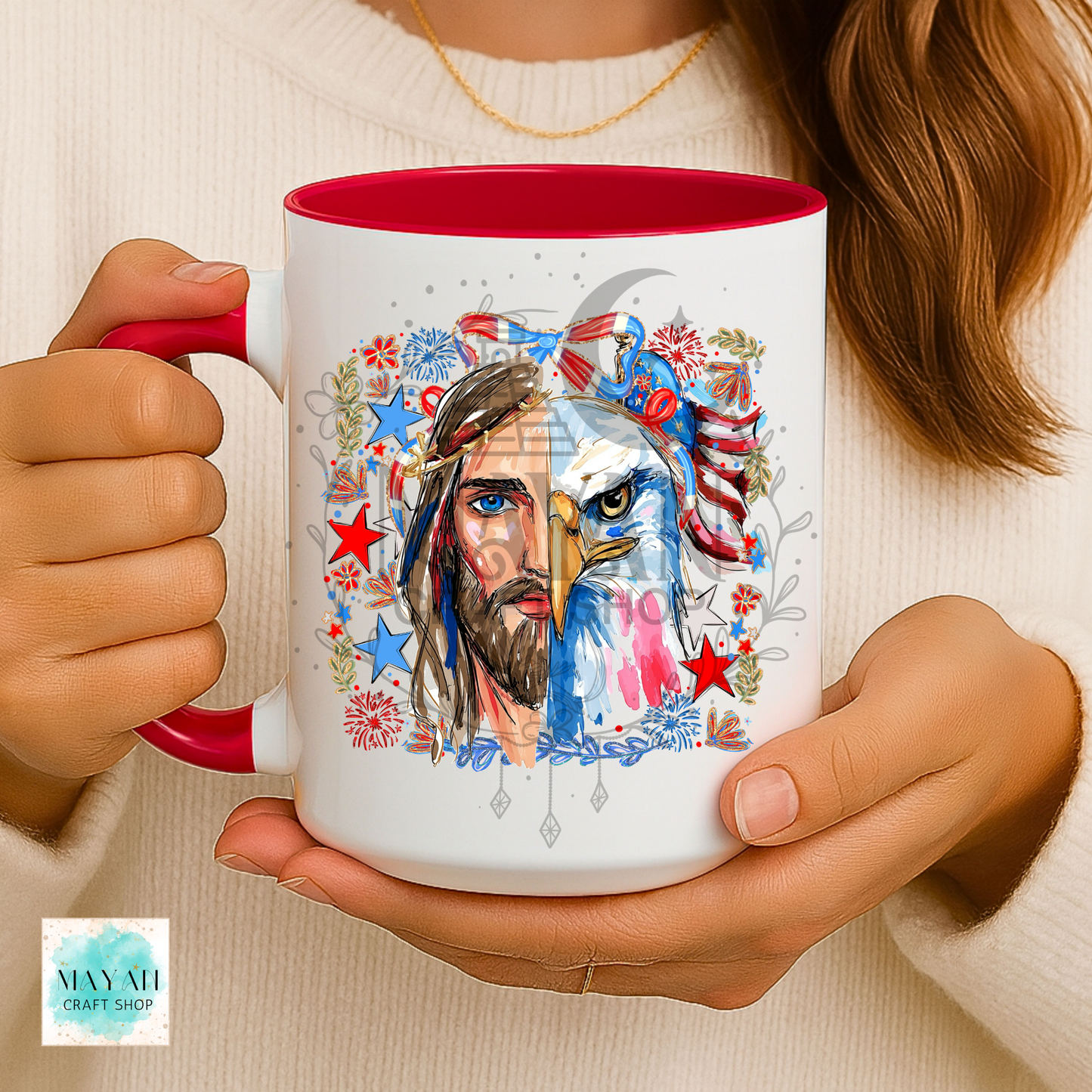 Person holding a mug with a colorful design of a face and eagle, featuring red, white, and blue colors.