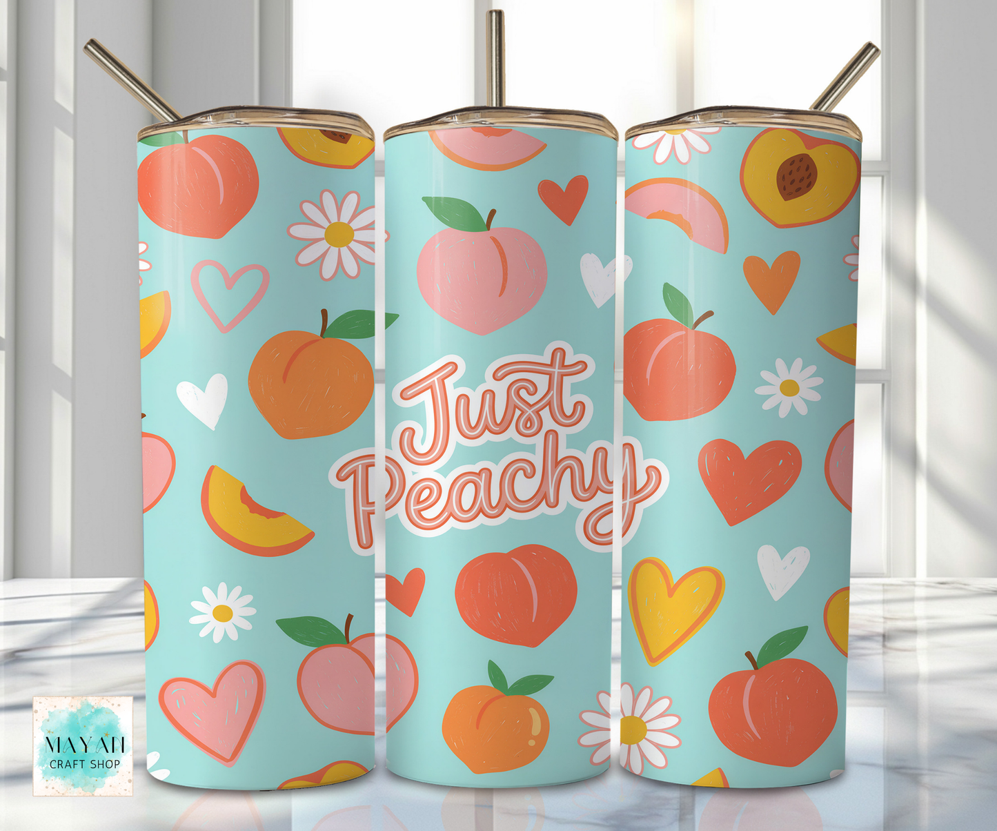 Three tumbler cups with peach-themed designs on a light background