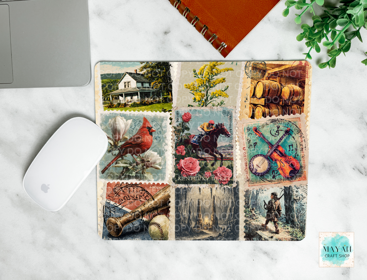 Collage of vintage-style postcards on a marble surface with a laptop and mouse.