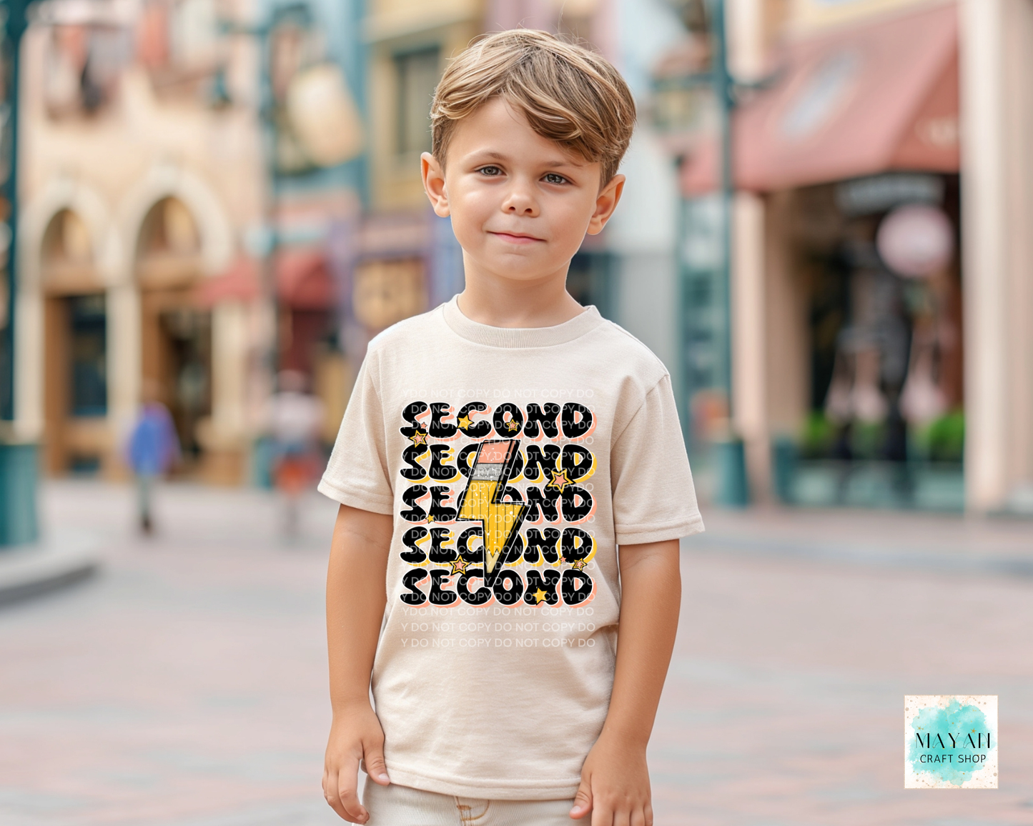 Child wearing a t-shirt with 'SECOND' text in an urban setting
