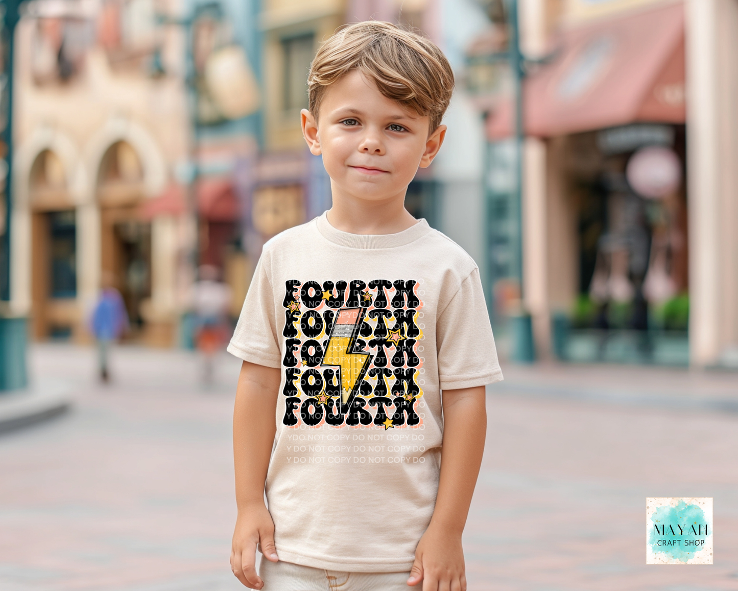Child wearing a t-shirt with 'FOURTH' printed on it, standing in an outdoor setting.