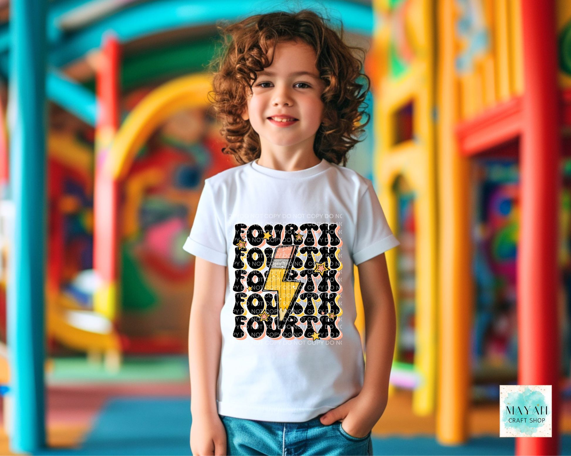 Child wearing a 'Fourth' themed t-shirt in front of colorful playground equipment