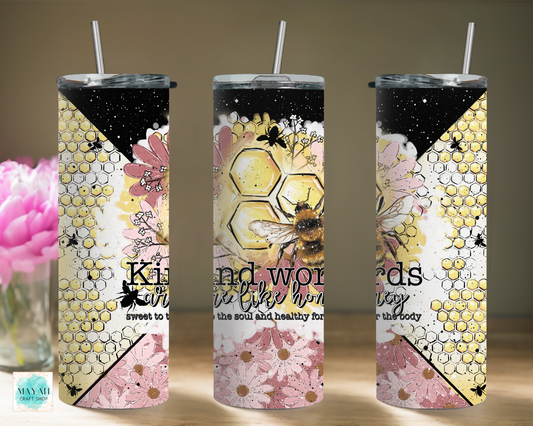 Three tumblers with floral and bee design on a neutral background
