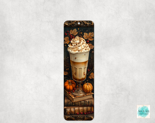 Decorative bookmark with a pumpkin spice latte design on a textured gray background
