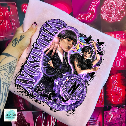 Hand holding a printed design with two people and purple text against a neon sign background.