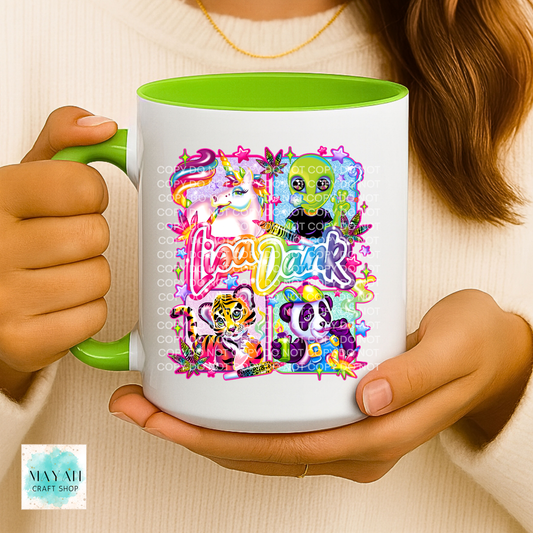 Person holding a mug with colorful design and text.