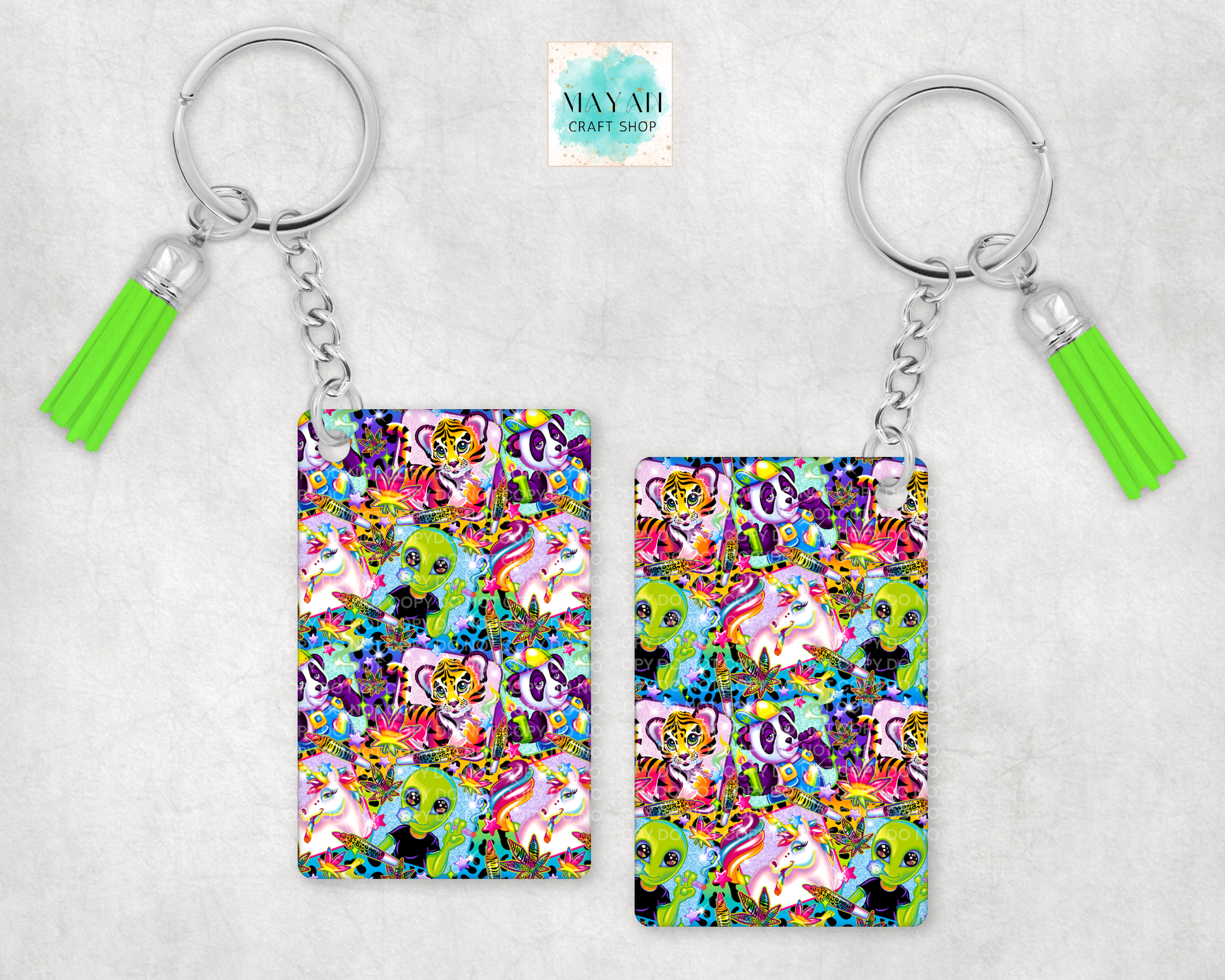 Keychain with colorful pattern and green tassel on a light gray background