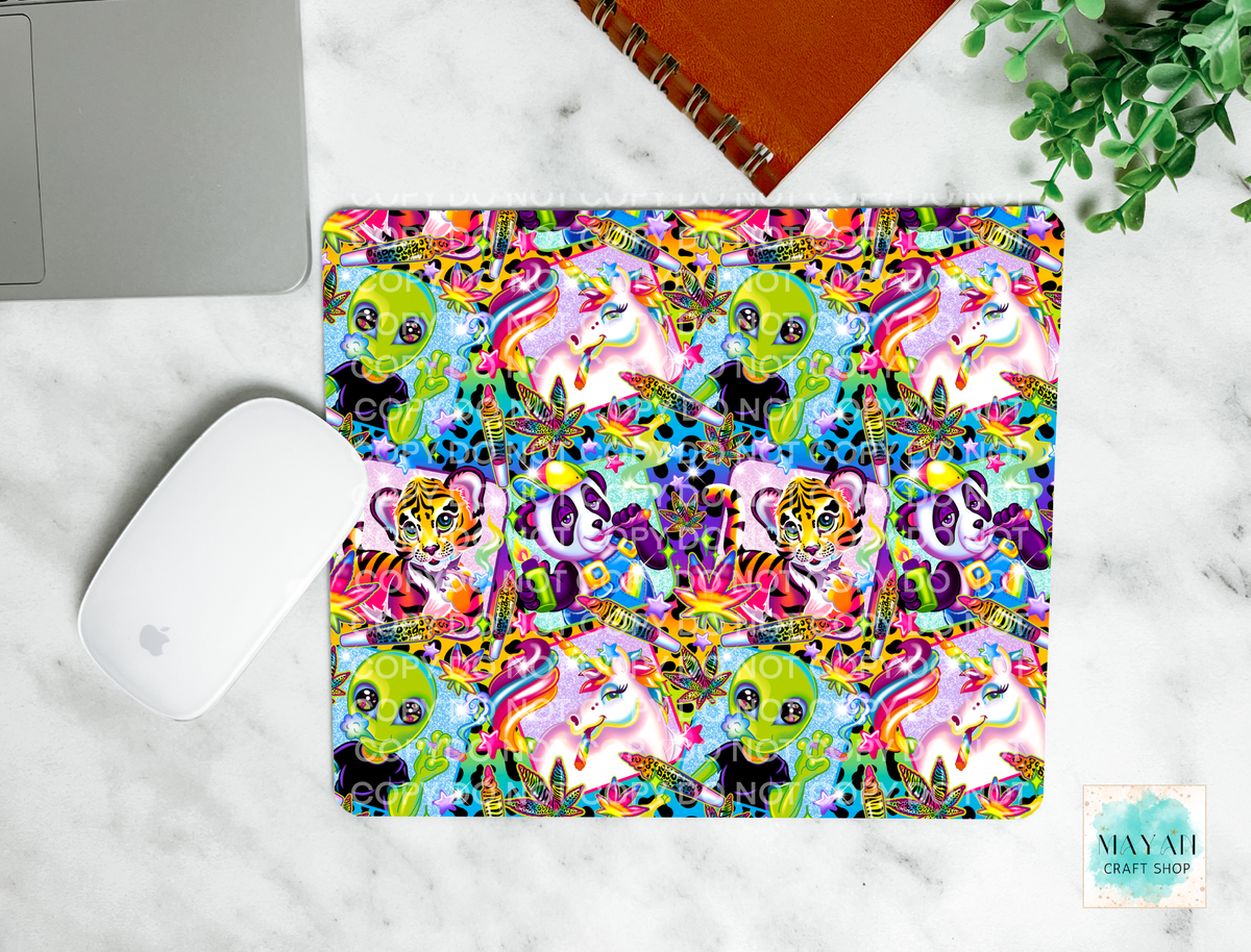 Colorful animal patterned mouse pad on a marble surface with a laptop and mouse.