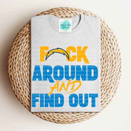 Gray t-shirt with colorful text on a woven surface