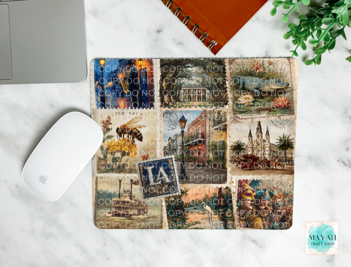 Collage of stamps in mouse pad on a desk with a laptop and mouse.