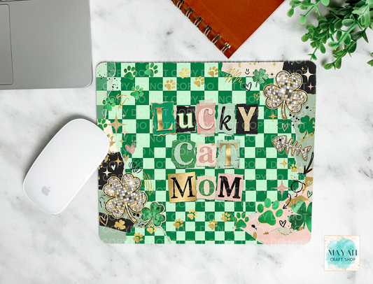 Mouse pad with 'Lucky Cat Mom' text on a checkered green and white background, placed on a marble surface.