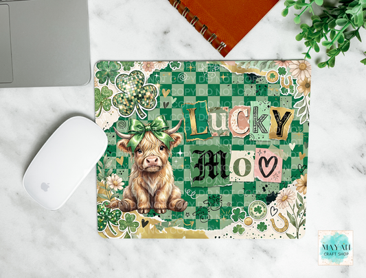 Mouse pad with a cow illustration and 'Lucky Moo' text on a checkered green background.
