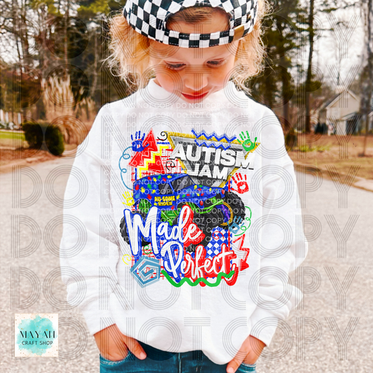 Child wearing a white sweatshirt with colorful text and graphics, standing outdoors.
