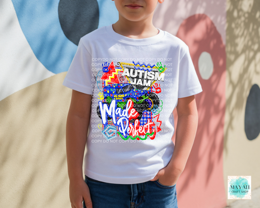 Child wearing a white t-shirt with colorful text and graphics, standing against a multicolored abstract background.