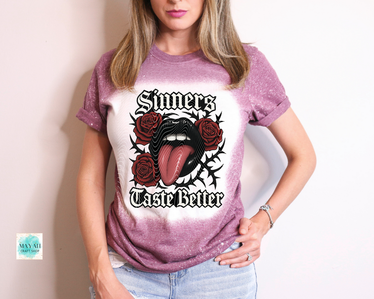Person wearing a t-shirt with a graphic design and text.