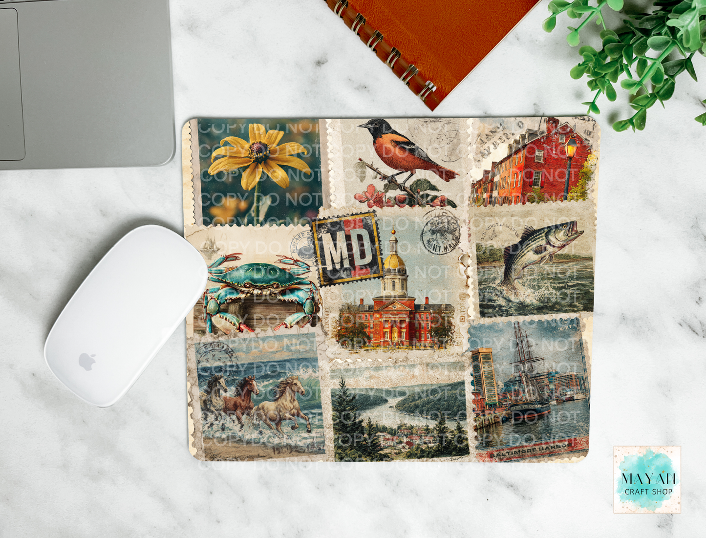 Mouse pad with vintage-style collage cover on a marble surface