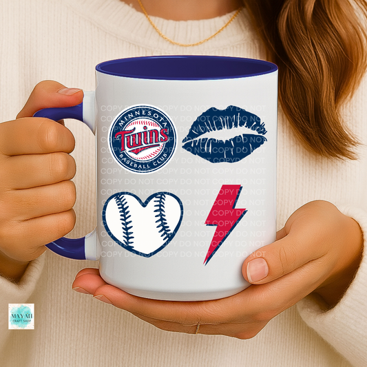 Person holding a mug with baseball logo and other designs