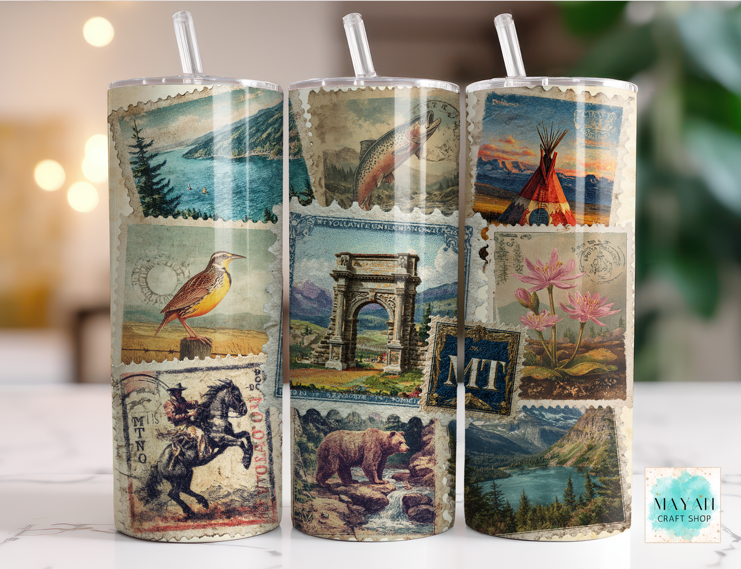 Three cylindrical tumbler with vintage-style illustrations on a blurred background