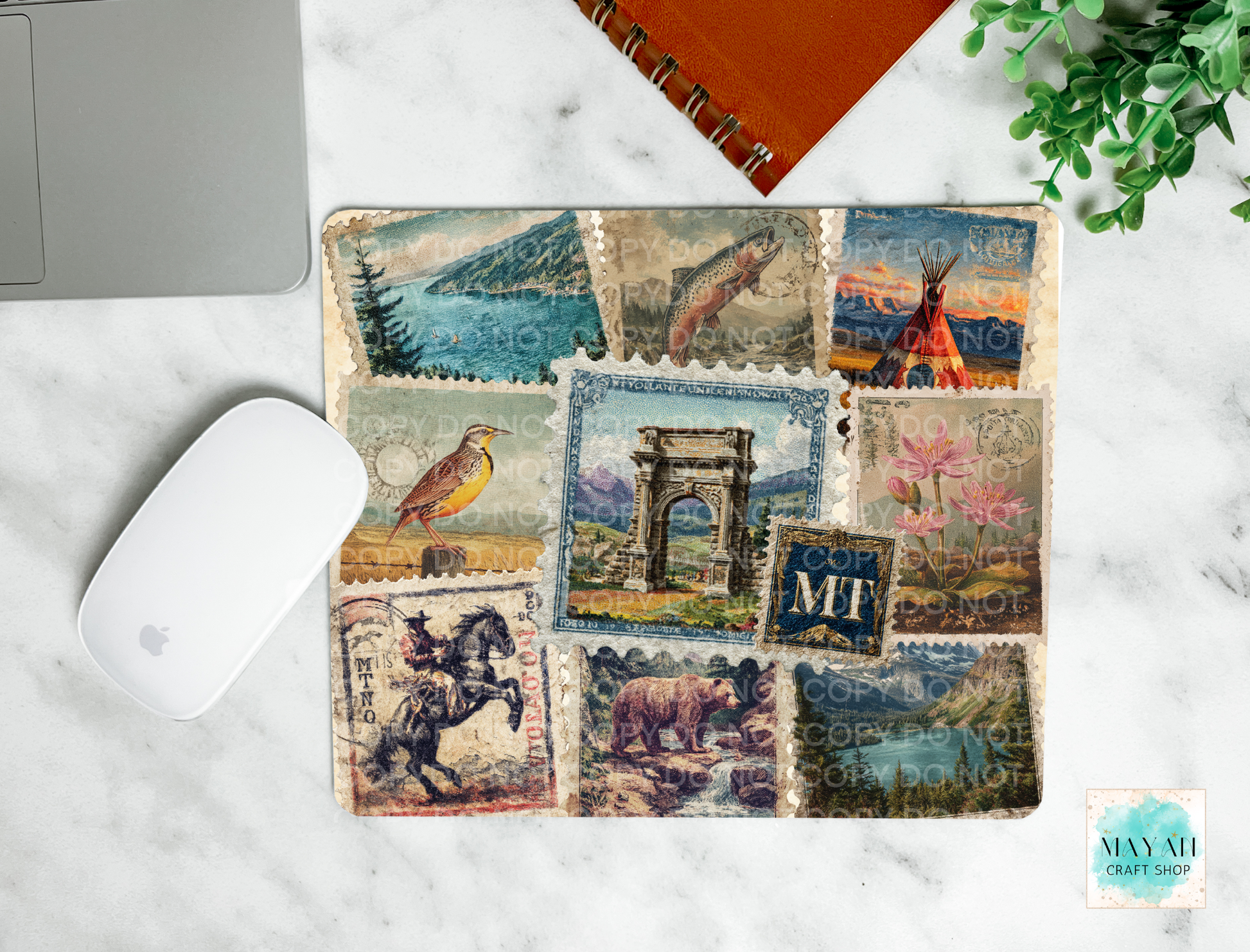 Mouse pad with vintage-style postage stamp design on a marble surface.