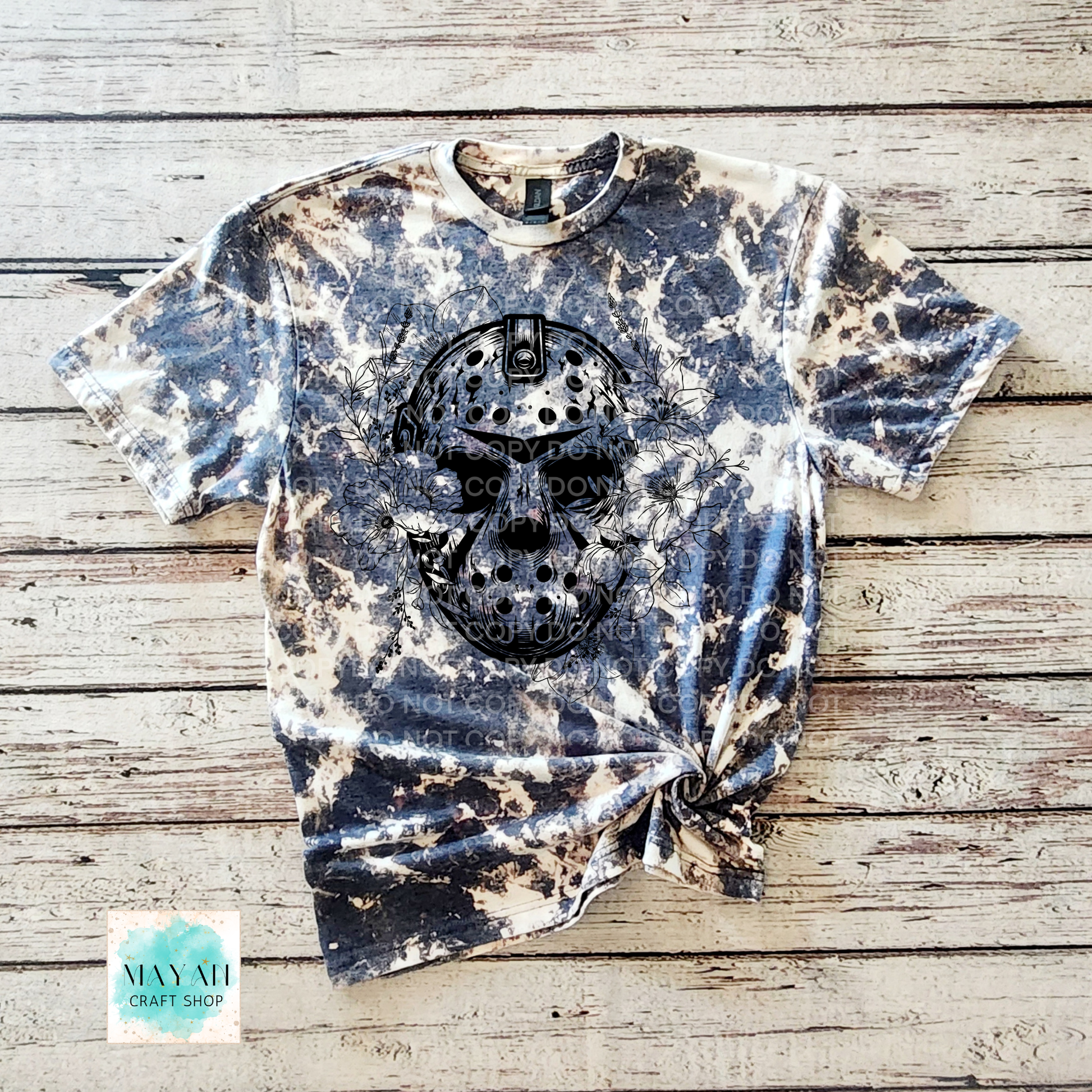 Bleached t-shirt with a skull design on a wooden surface