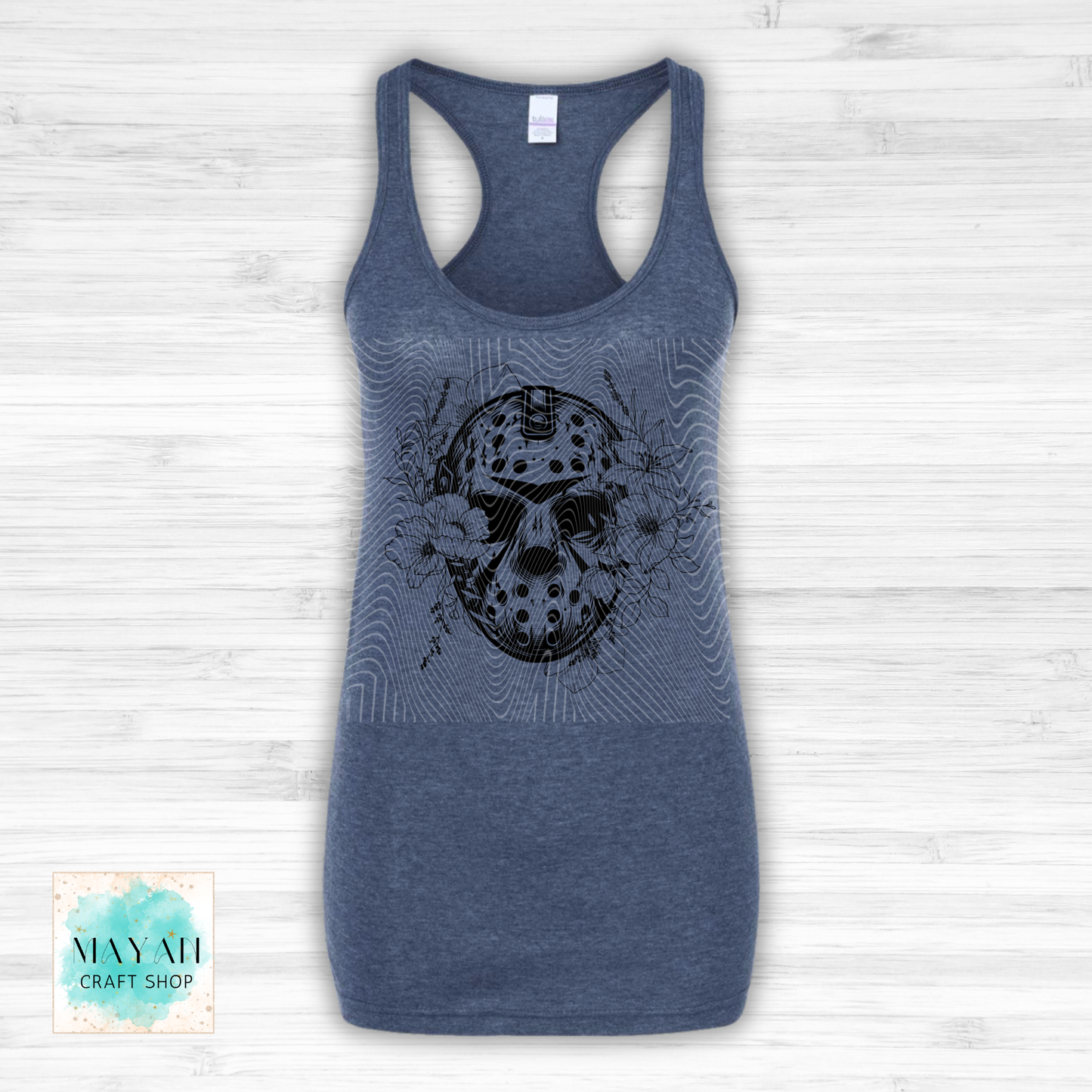 Blue tank top with a graphic design on a white wooden background