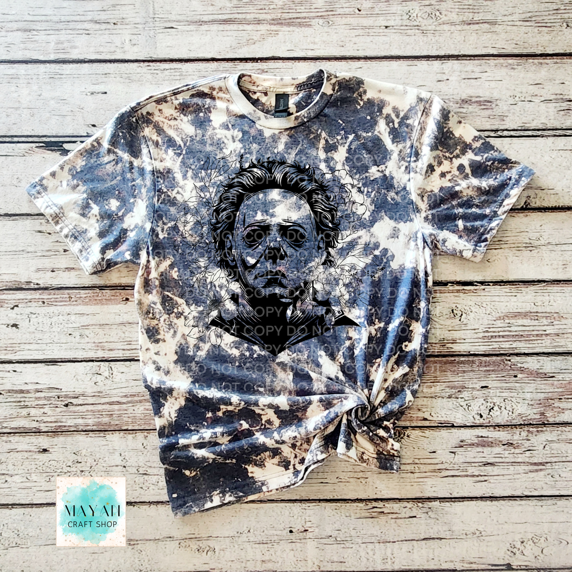 Bleached t-shirt with a graphic design on a wooden surface