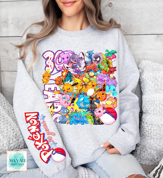 Person wearing a gray sweatshirt with colorful graphic design and text.